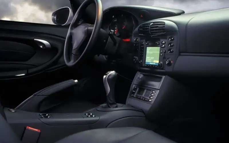 Dark leather interior and dashboard of a sports car