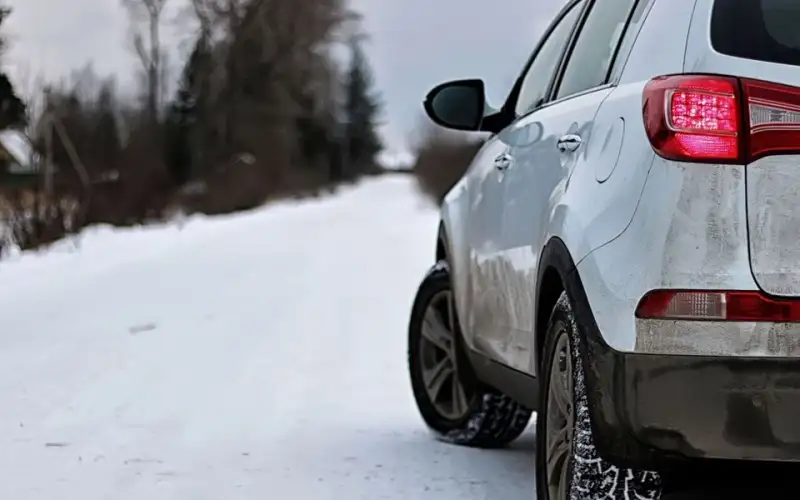 White SUV on a snowy road