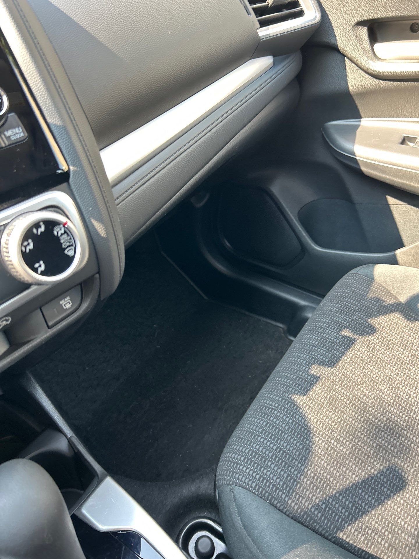 After: the same Honda Fit console and carpet steam cleaned by Eco Car Cafe