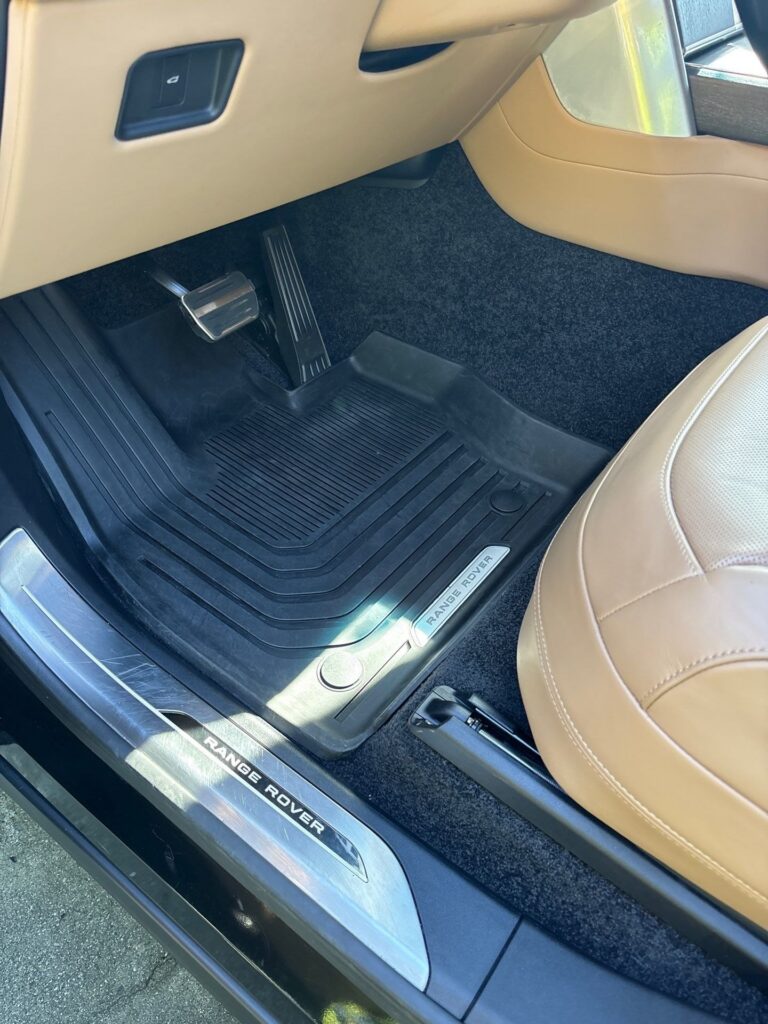 After: the same Range Rover footwell and floor mat cleaned back to factory condition