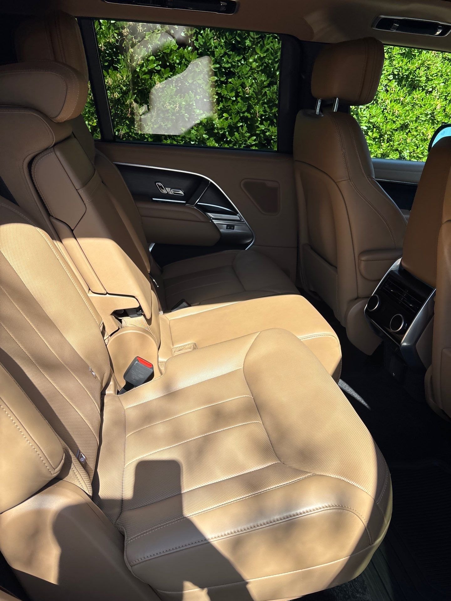 After: the same Range Rover rear cabin vacuumed and the tan leather conditioned