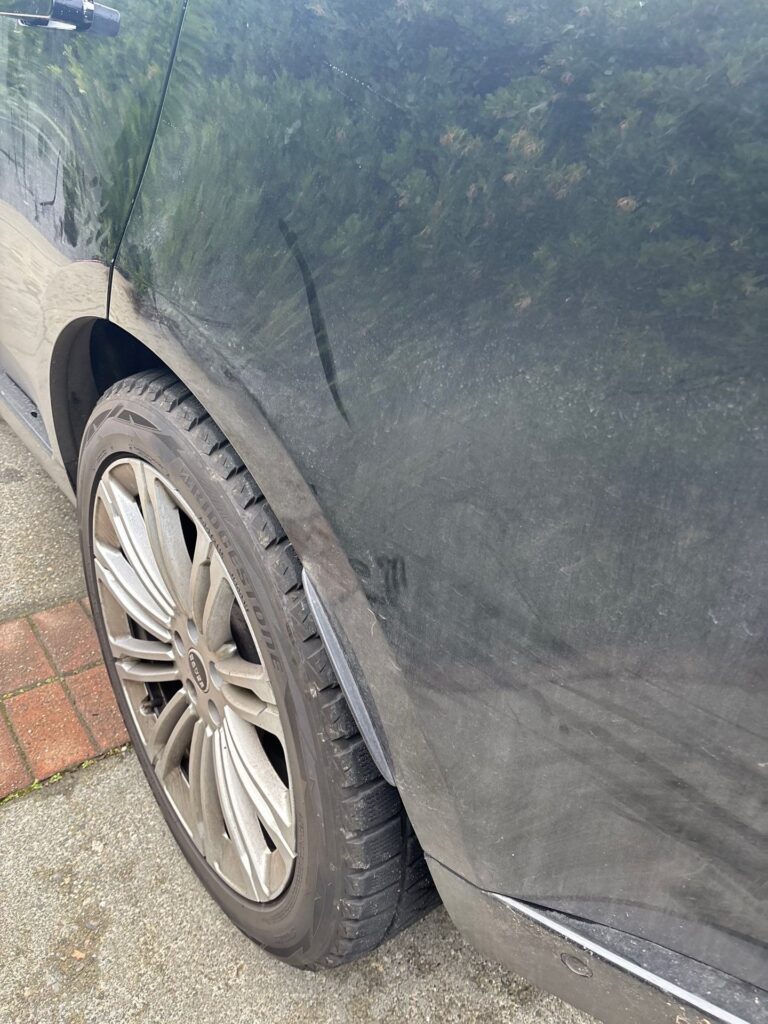 Before: dull, road-grimed black paint and a brake-dusted wheel on a Range Rover