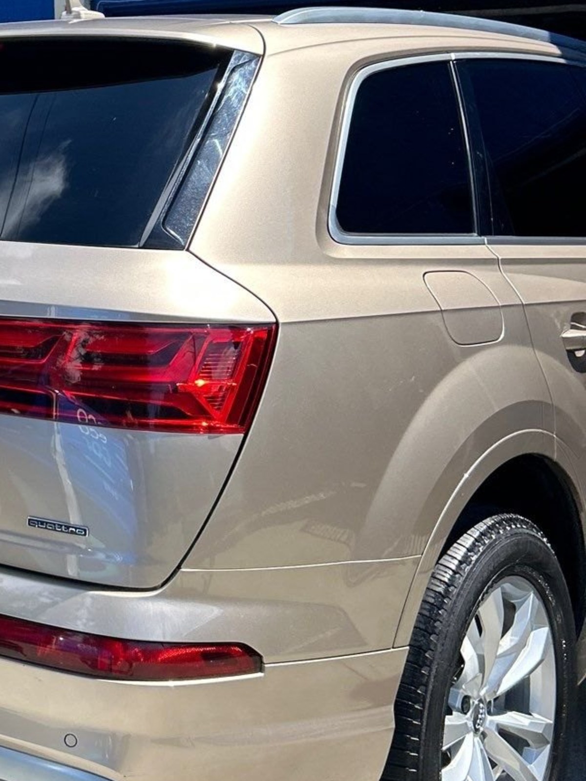 Close-up of an Audi Q7 rear quarter panel and taillight after an Eco Car Cafe exterior detail