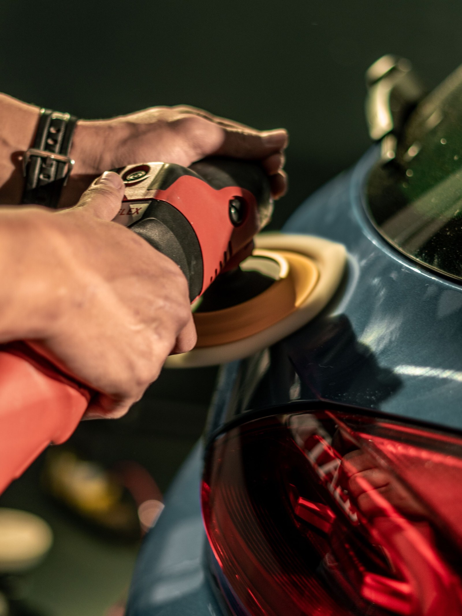 Compounding pass with a machine polisher on a vehicle panel