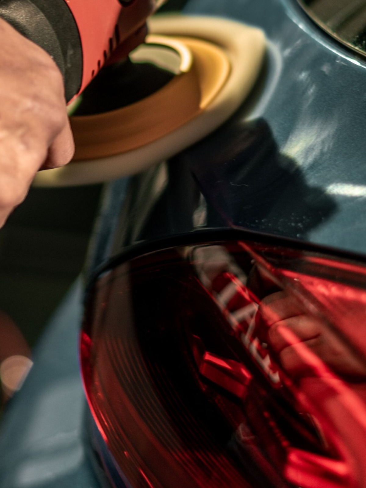 Compounding pass with a machine polisher on a vehicle panel