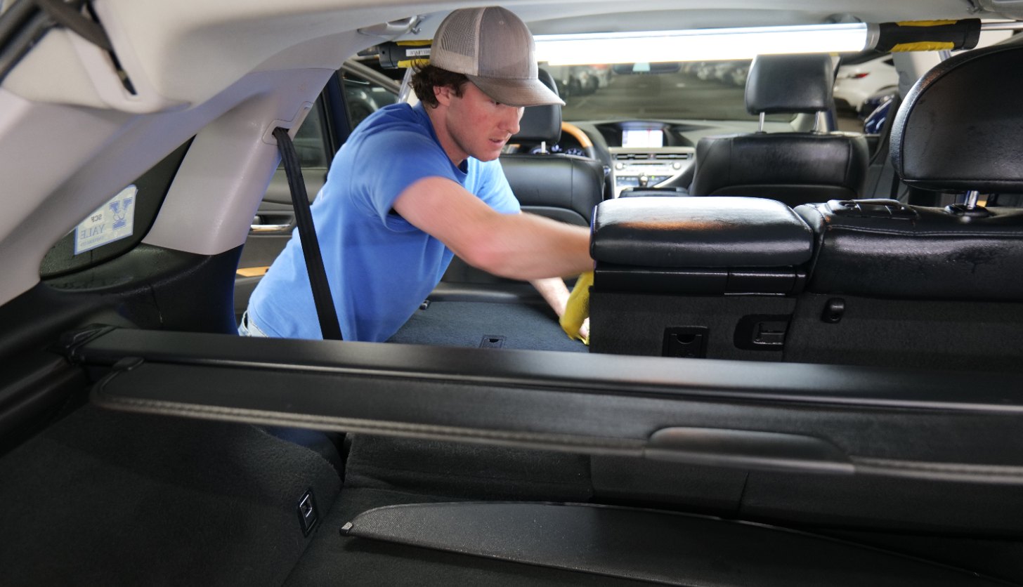 Eco Car Cafe technician detailing the cabin of a vehicle